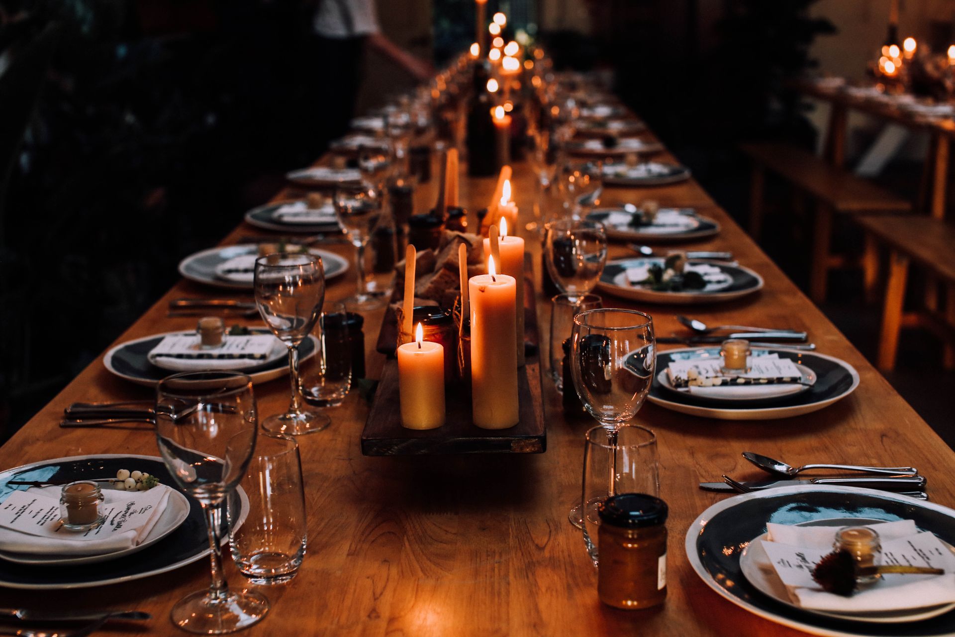 Candlelit winter reception table set for a wedding dinner